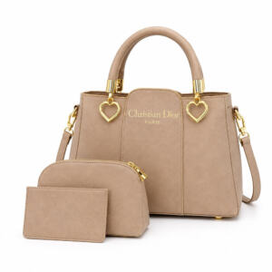 Upgrade your everyday style with this Elegant Beige Women's Handbag 3-Piece Set, thoughtfully designed for women who appreciate fashion and functionality. Crafted from premium-quality PU leather with a soft, luxurious finish, this sophisticated handbag features elegant gold-tone hardware and heart-shaped accents that add a refined touch. The spacious main handbag offers ample room for your daily essentials, making it perfect for work, shopping, travel, university, office, or casual outings. It includes a comfortable top handle and an adjustable shoulder strap, allowing you to carry it as a handbag or crossbody bag according to your preference. This stylish set also includes a matching cosmetic pouch and card holder, keeping your essentials organized while complementing your overall look. The neutral beige color pairs beautifully with both eastern and western outfits, making it a versatile accessory for every season. Whether you're heading to the office, attending a dinner, or searching for the perfect gift, this premium handbag set combines elegance, durability, and practicality in one fashionable package. Product Features Premium PU leather construction Elegant beige color with gold-tone hardware Spacious main compartment Comfortable top handles Adjustable & detachable shoulder strap Matching cosmetic pouch included Matching card holder included Lightweight and durable design Ideal for office, travel, shopping & everyday use Perfect gift for women and girls